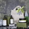 Arette skincare products with a decorative bag and Christmas tree on a textured surface.