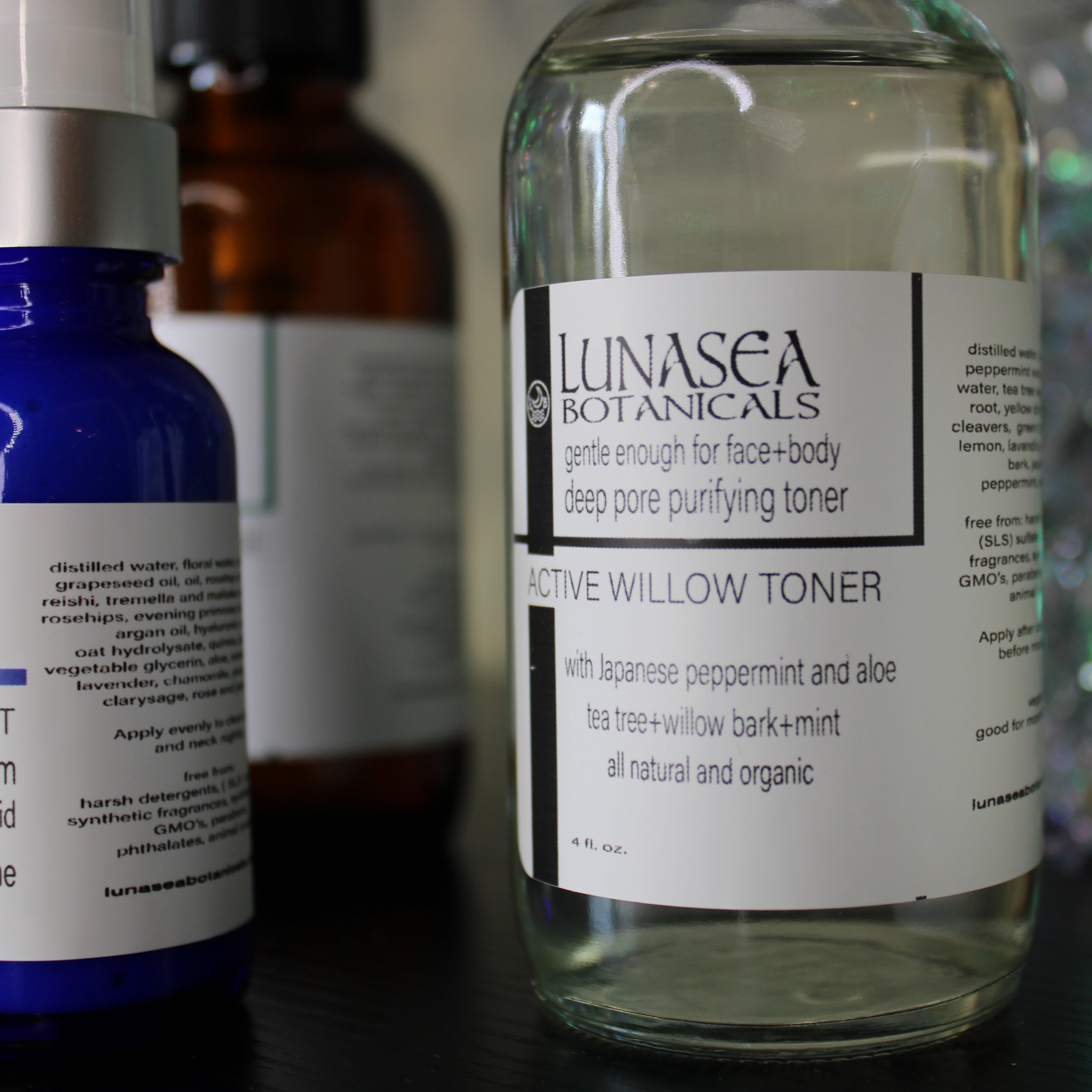 Lunasea Botanicals skincare products on a blurred background