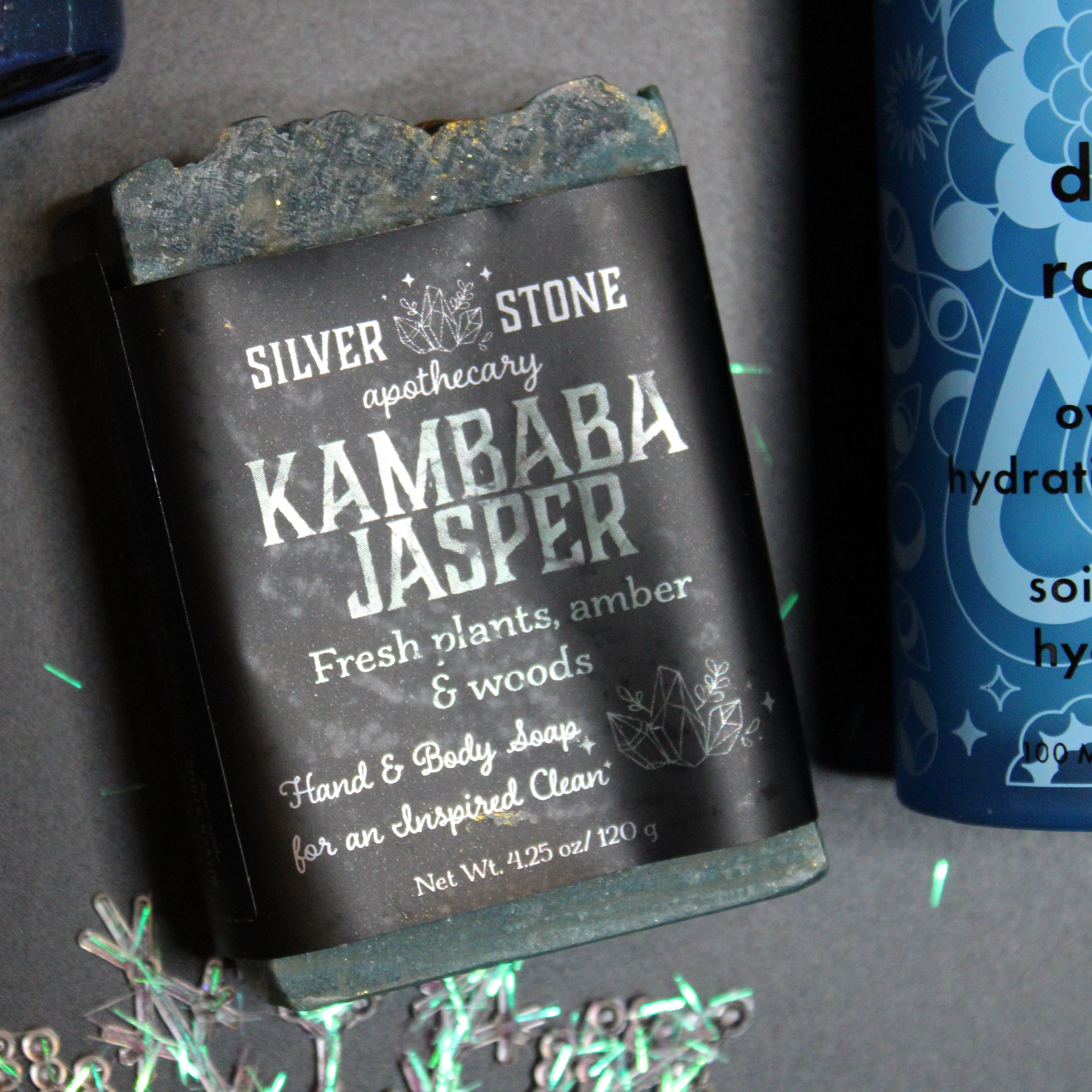 Bar of soap with 'Silver Stone Apothecary' branding on a gray surface.
