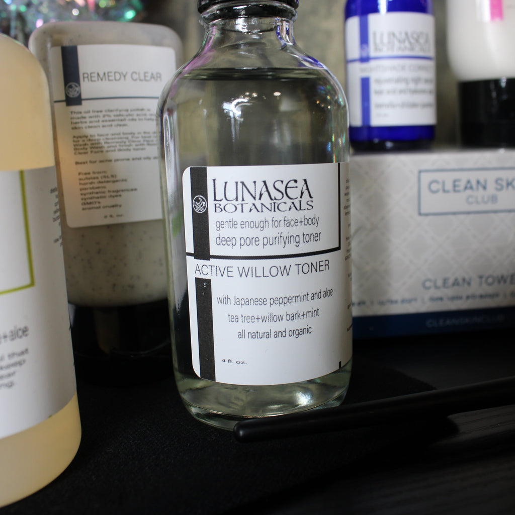 Bottles of Lunasea Botanicals skincare products on a shelf.