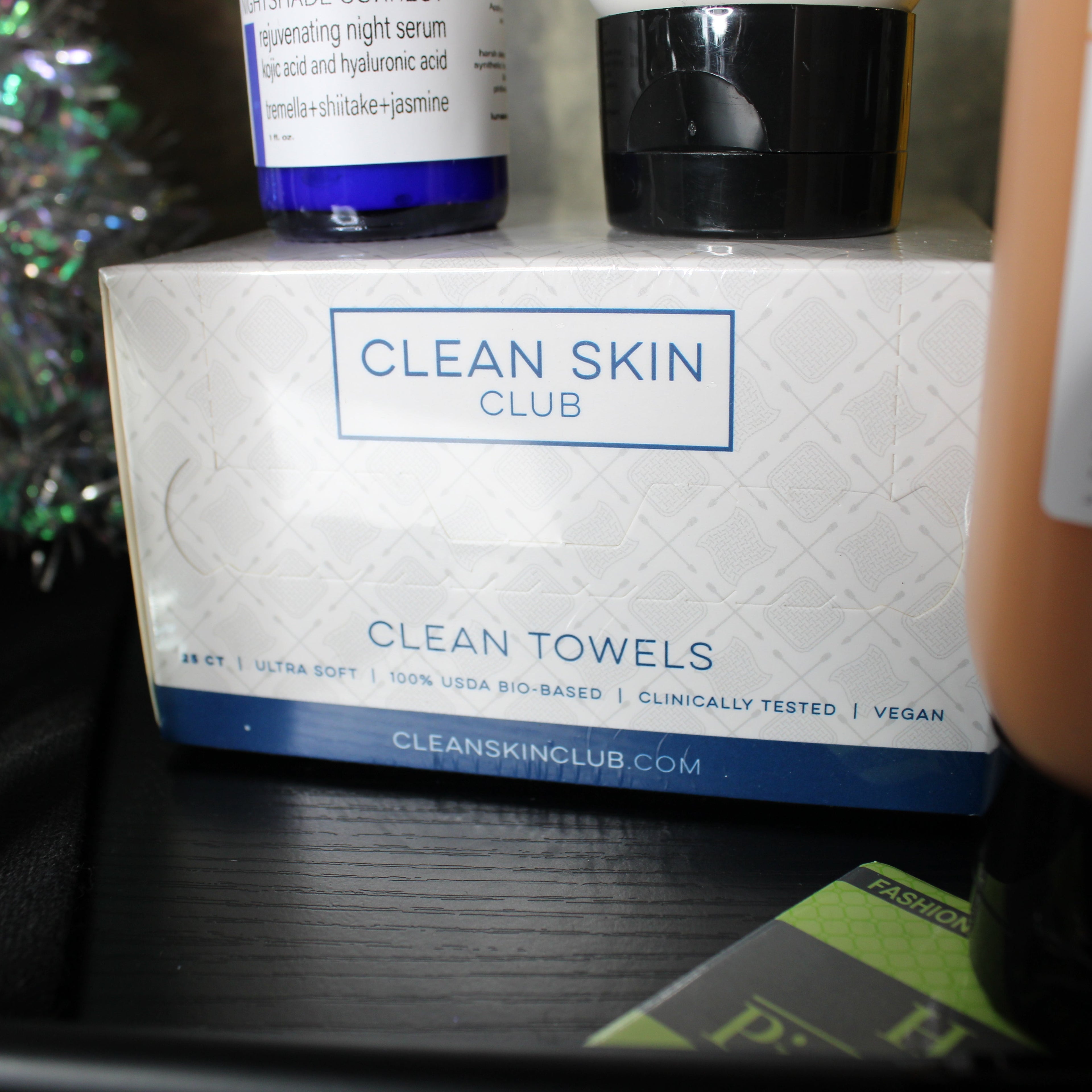 Clean Skin Club product packaging on a shelf with other items.