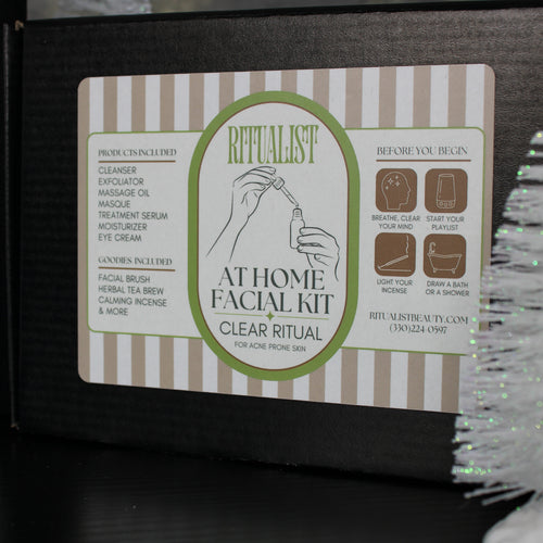 At Home Facial Kit packaging with brand logo and text on a striped background